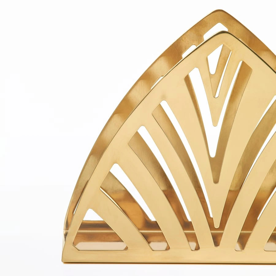 Close-up of IKEA stainless steel napkin holder gold finish