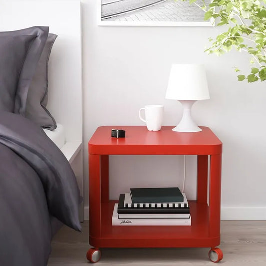 IKEA TINGBY side table on castors red 50x50 cm in living room.