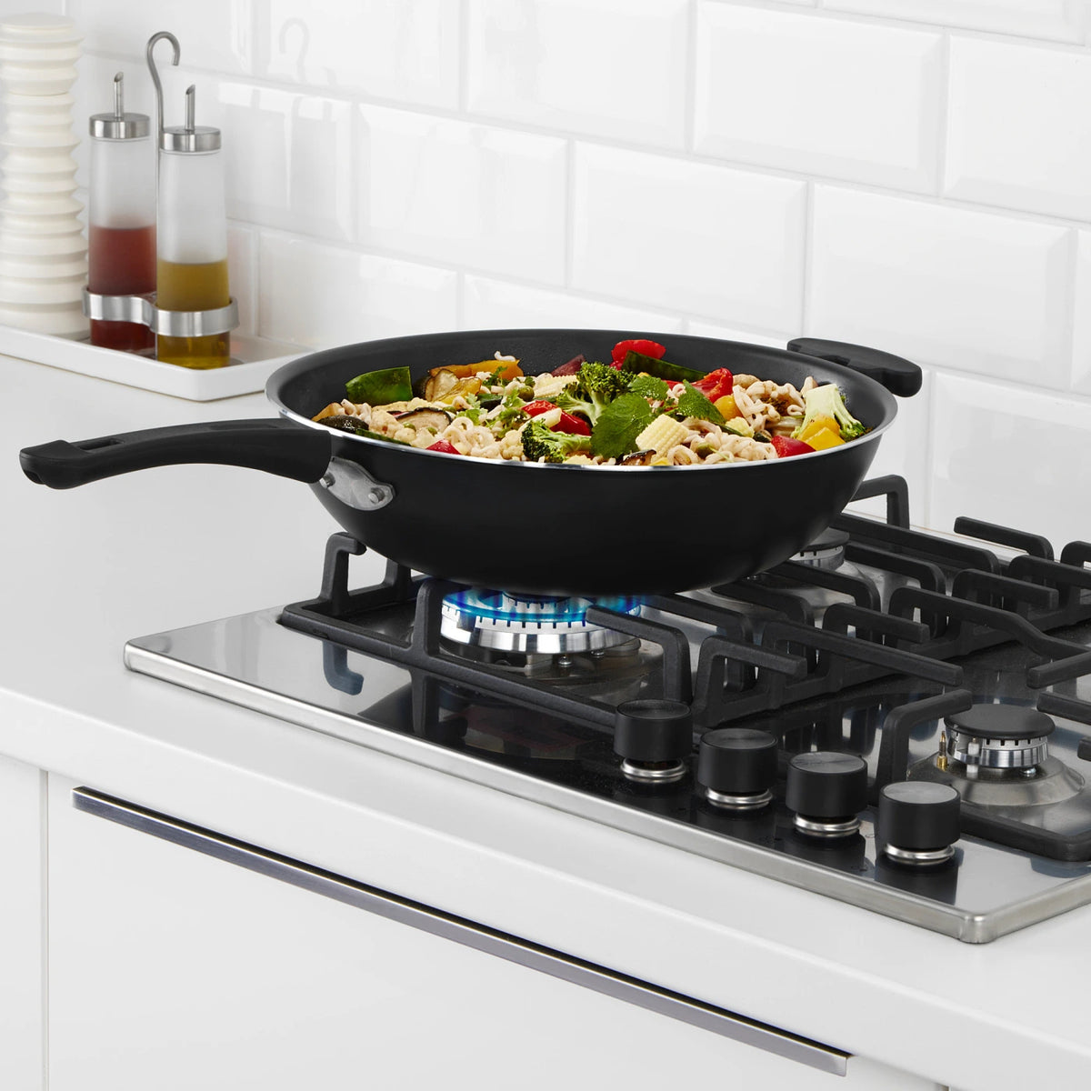 IKEA TOLERANT wok shown in a stir-fry cooking setting