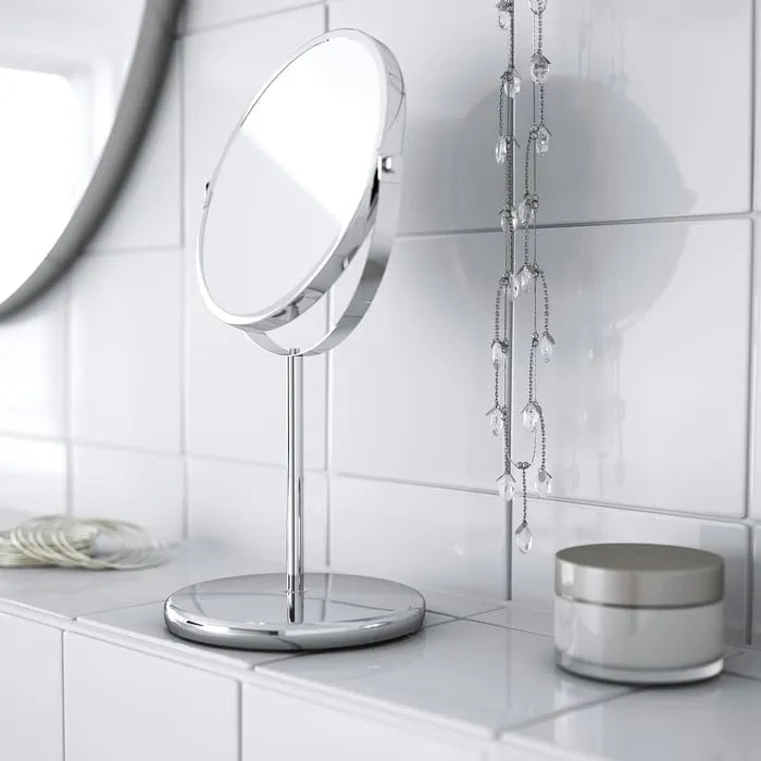 Double-sided IKEA TRENSUM mirror for makeup and grooming.