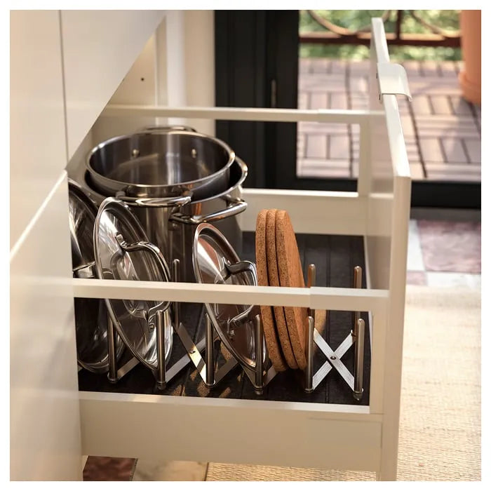 IKEA VARIERA pot lid organiser in kitchen cabinet.