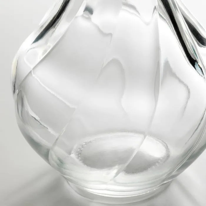 Close-up of IKEA VILJESTARK clear glass vase.