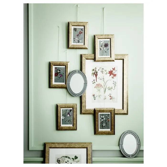 Small IKEA VIRSERUM picture frame gold for wall or tabletop use.