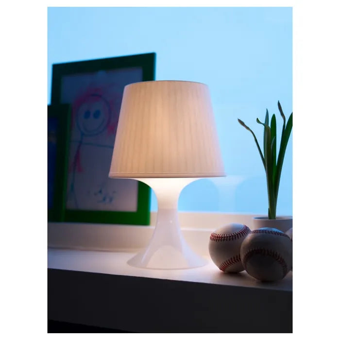 IKEA LAMPAN lamp placed in corner for cosy mood lighting