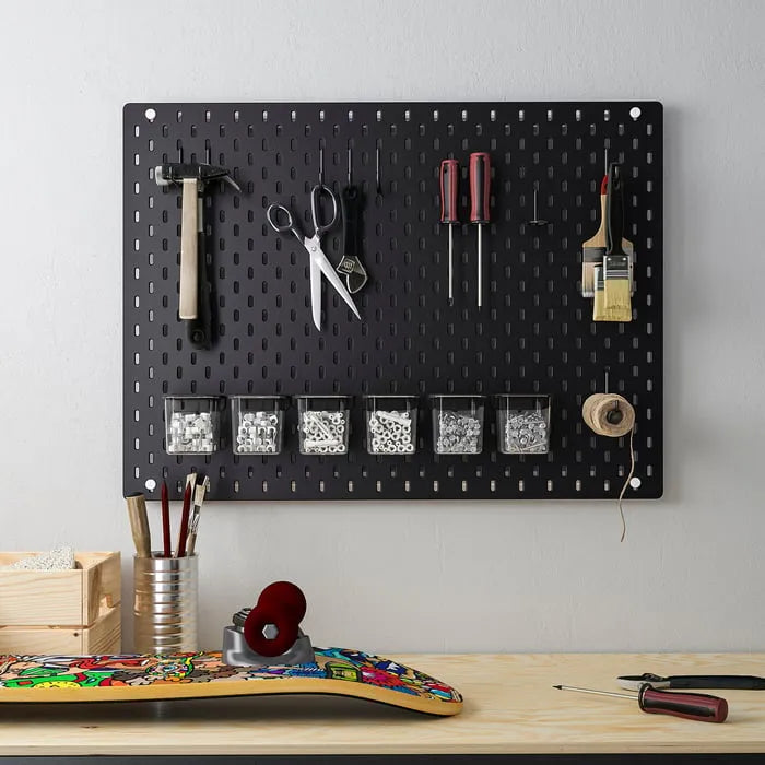 IKEA SKÅDIS hook holding accessories in home office